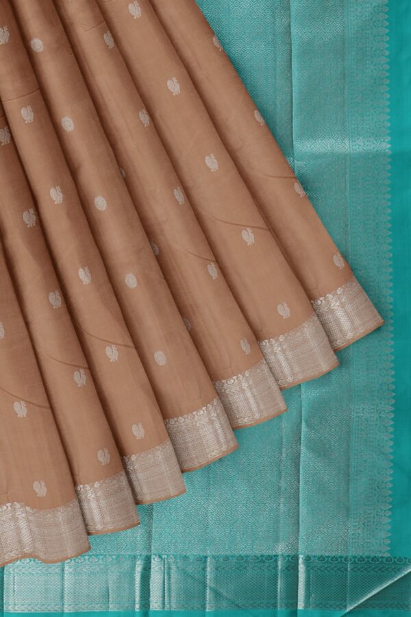 Light brown saree with turquoise blue border