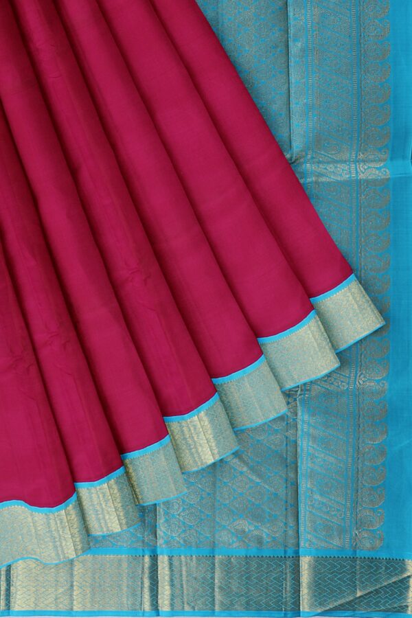 Magenta saree with Sky Blue Border