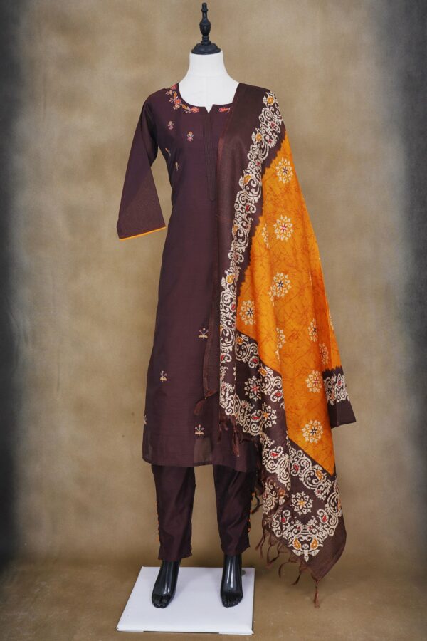 Brown floral top with brown bottom and orange shawl