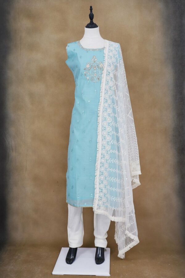 Light blue floral design top with white bottom and white shawl kurti