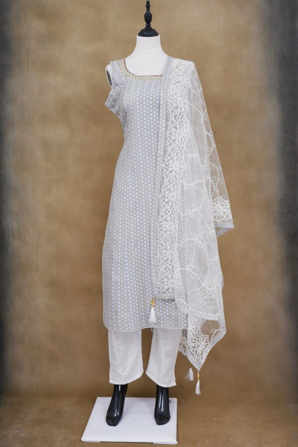 Light grey top with white bottom and netted shawl kurti