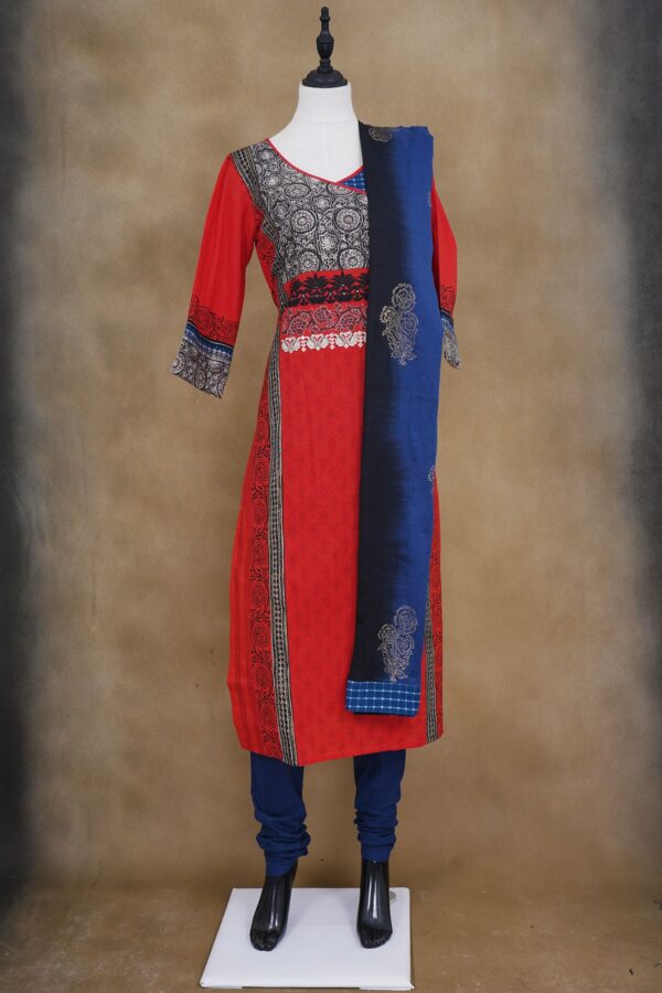 Red design top with blue bottom and blue shawl kurti