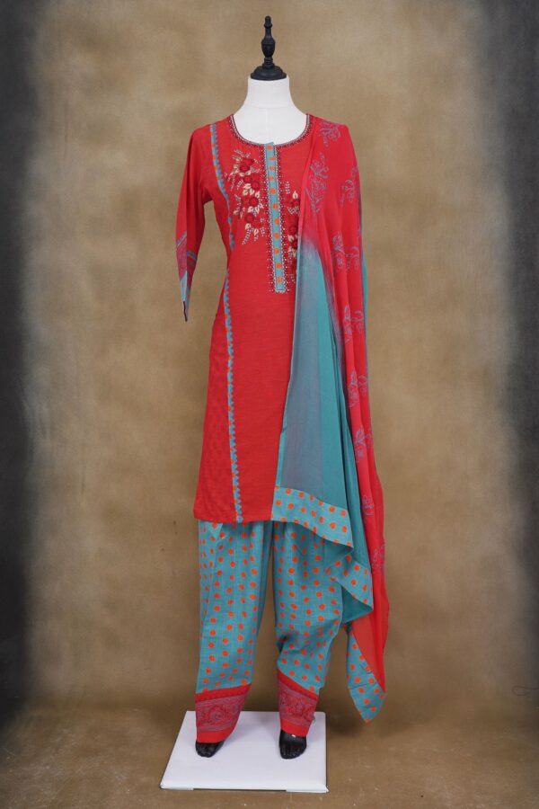 Red floral design top with turquoise blue bottom with red shawl kurti