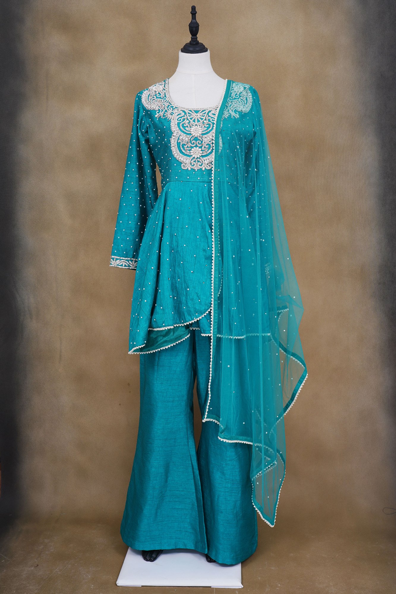 Turquoise blue design top with turquoise blue palazzo and netted shawl kurti