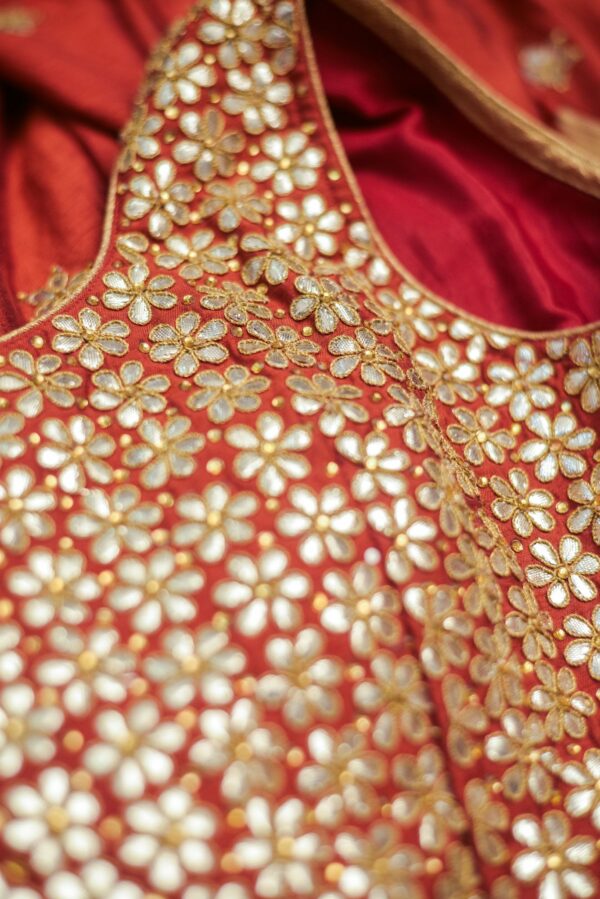 Golden floral top with red floral design bottom Lehenga - Image 3