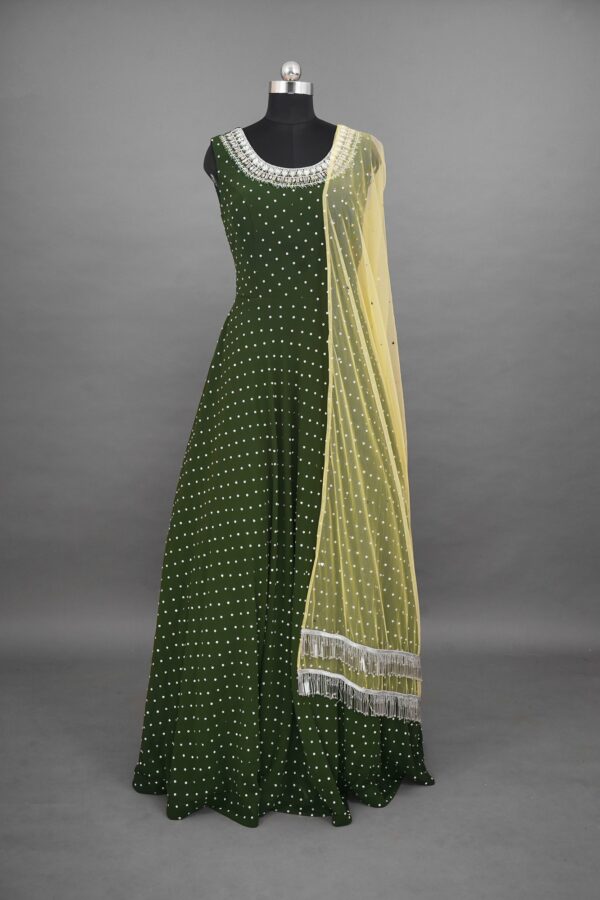Green lehenga with Silver colour design and beige shawl