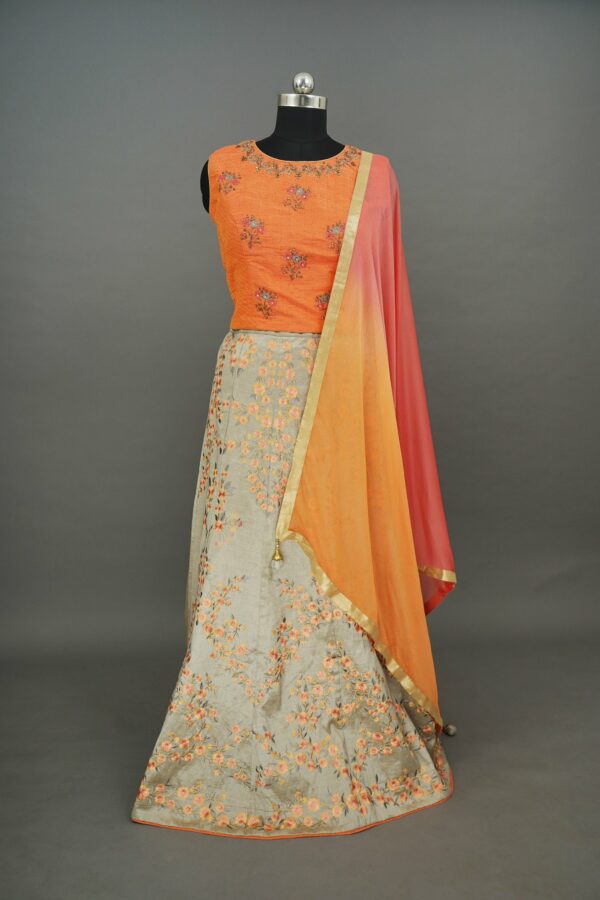Orange top with light grey floral design bottom lehenga