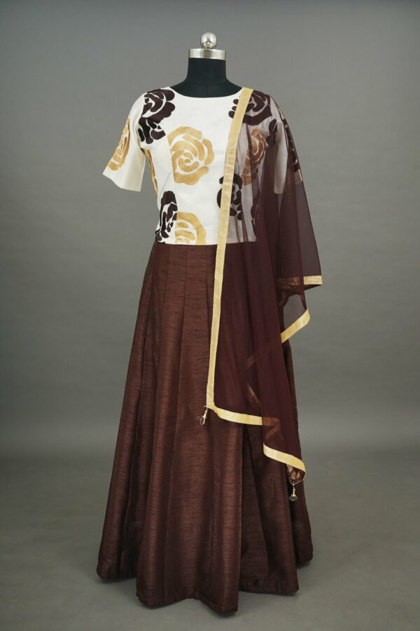 White floral top with brown bottom lehenga