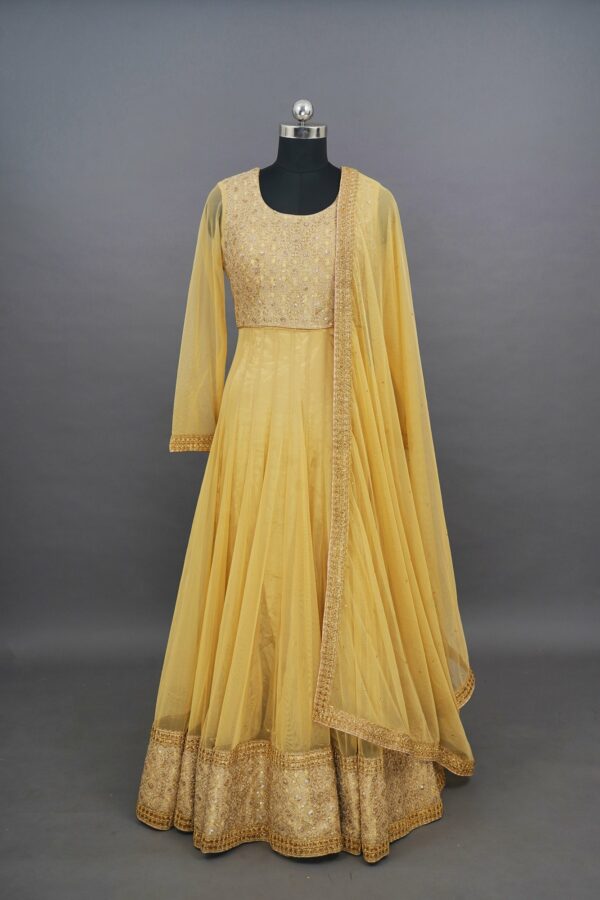 Yellow floral top with net bottom design lehenga