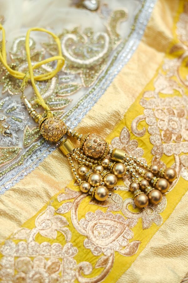 Yellow floral top with white net bottom lehenga - Image 3