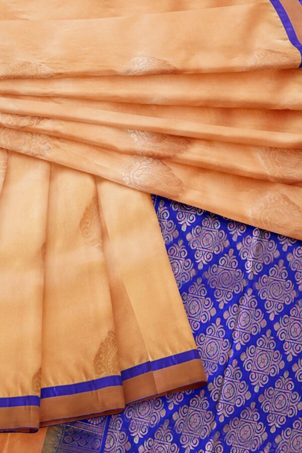sri kumaran stores soft silk saree light apricot saree with ultramarine blue zari border and pallu 4